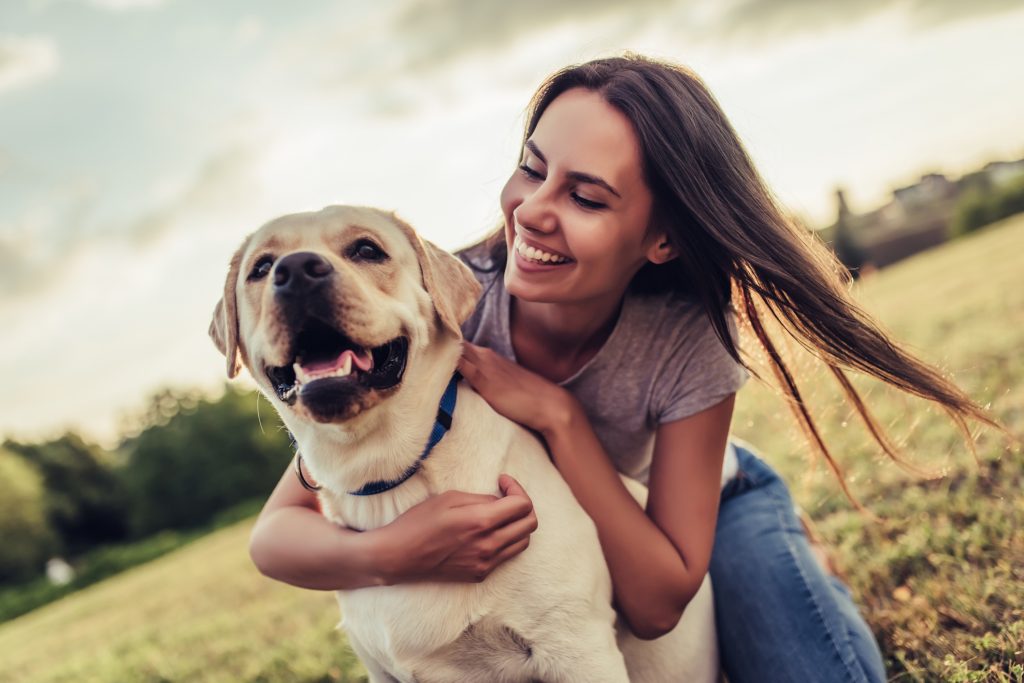 Walking a dog for exercise outdoors